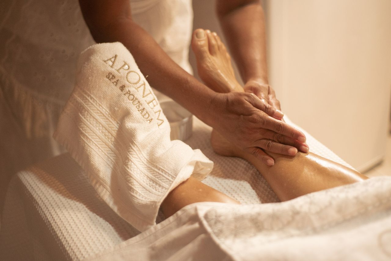 why-choose-us-02 Close-up of a foot massage at Aponema Spa, emphasizing relaxation and wellness.
